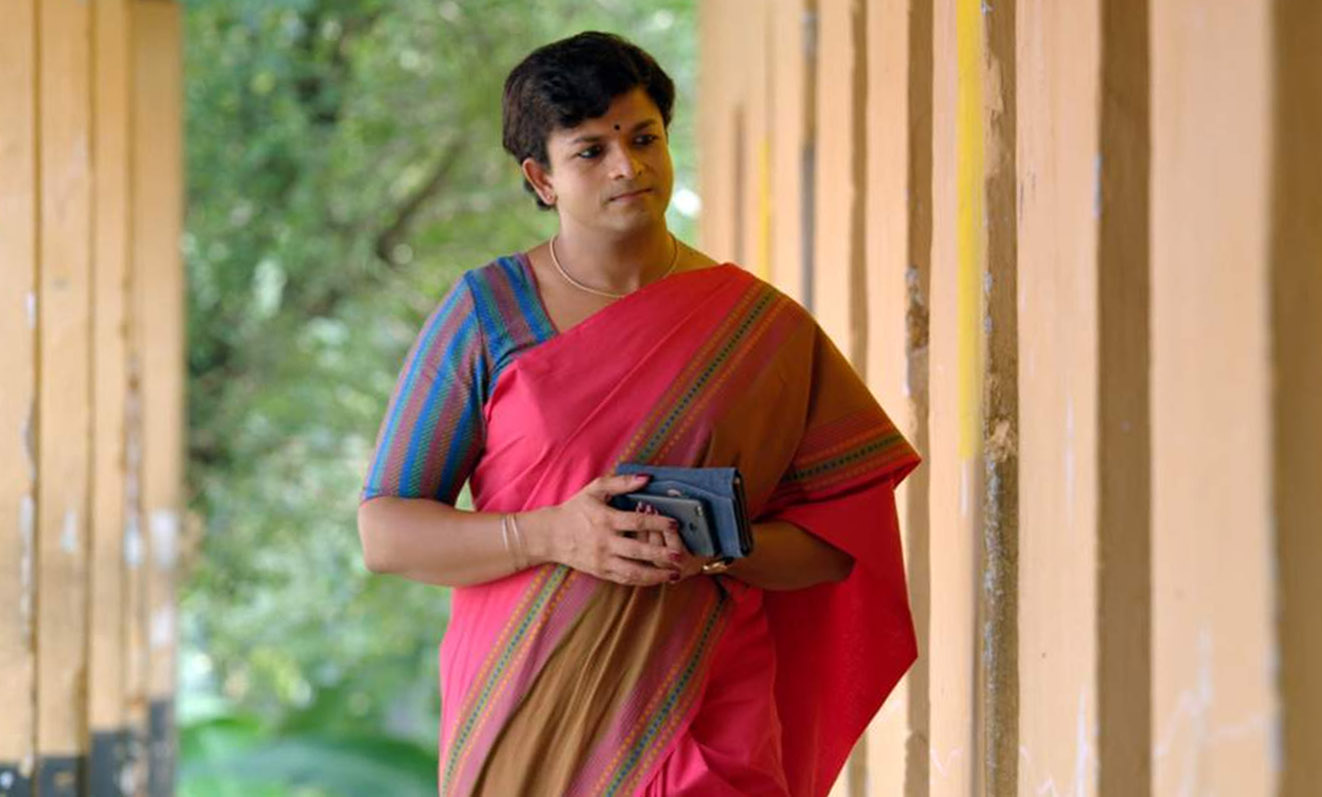 Screenshot of Marykutty walking along a corridor, from the film Njaan Marykutty