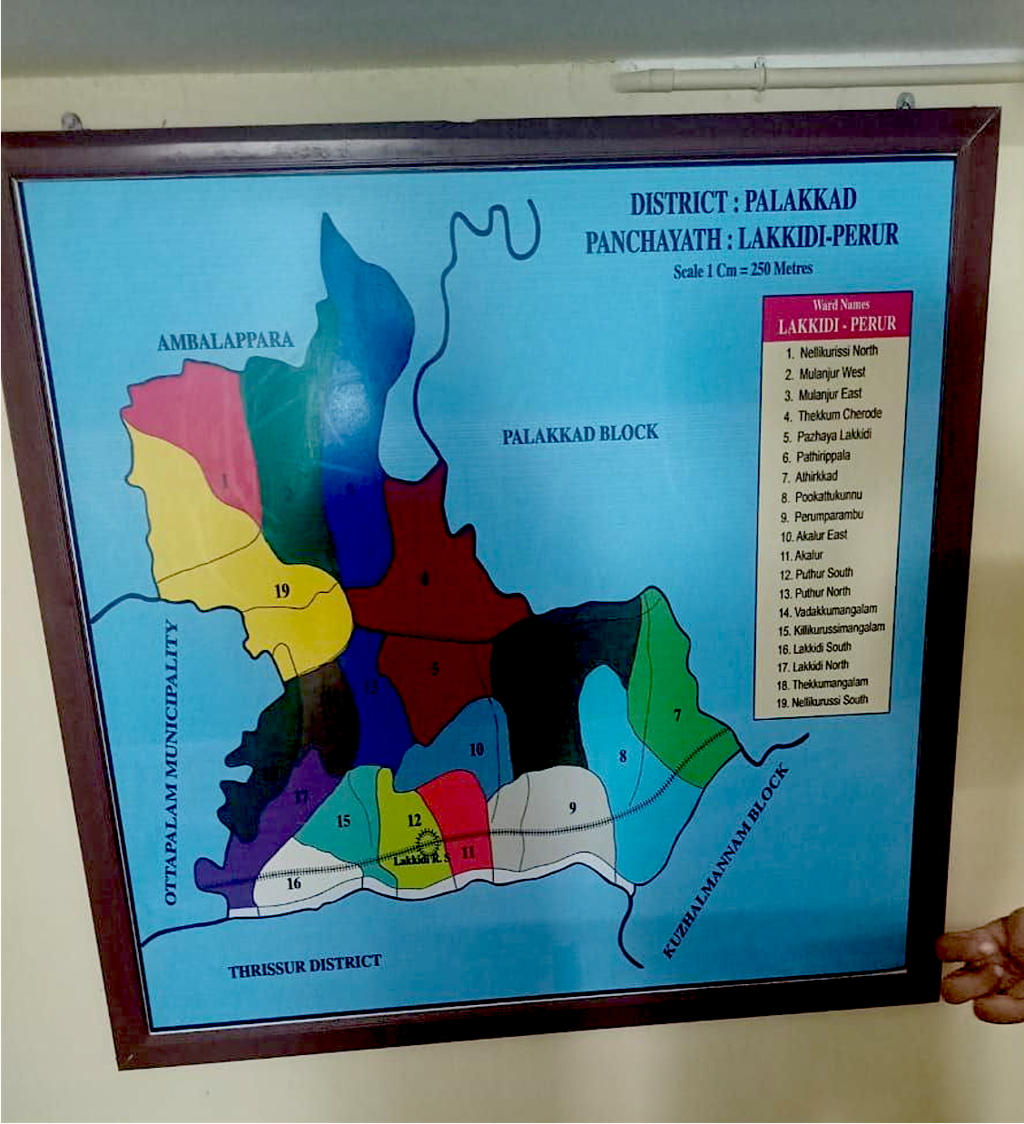 A photo of a framed map on a wall of the Lakkidi-Perur panchayat of Palakkad district.